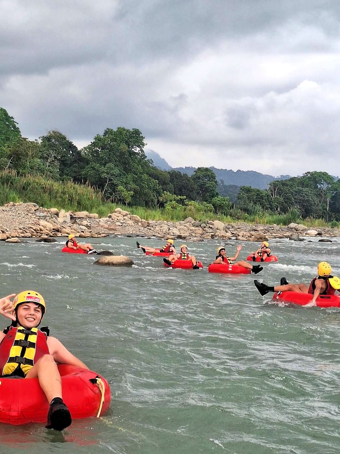 Guest relaxing in a tube on the lower Naranjo